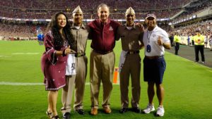 Col. Guieb with family and chancellor on Kyle Field