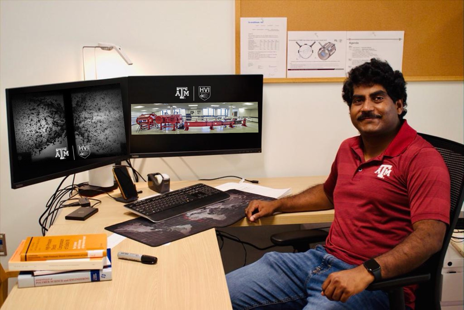 Dr. Kalyan Raj Kota sits at his desk in the Hypervelocity Impacts Laboratory.